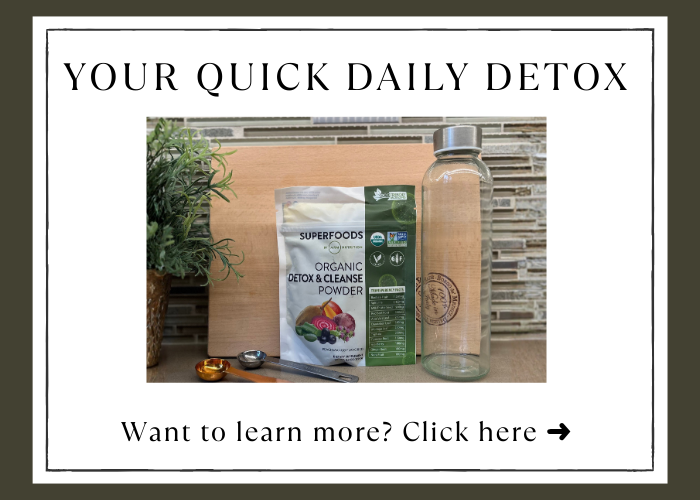 Organics Superfoods Detox & Cleanse Powder displayed on a kitchen counter with a glass bottle and measuring spoons, promoting a quick daily detox routine. The organic peach‑mango detox powder is shown as a plant‑based superfood blend for gentle daily cleansing and wellness support.